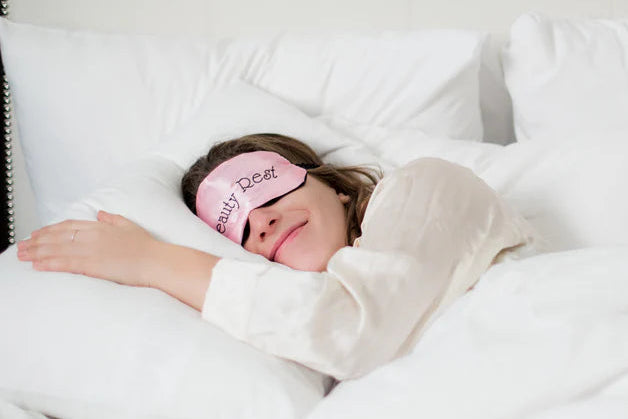woman-sleeping-in-white-bed with mask